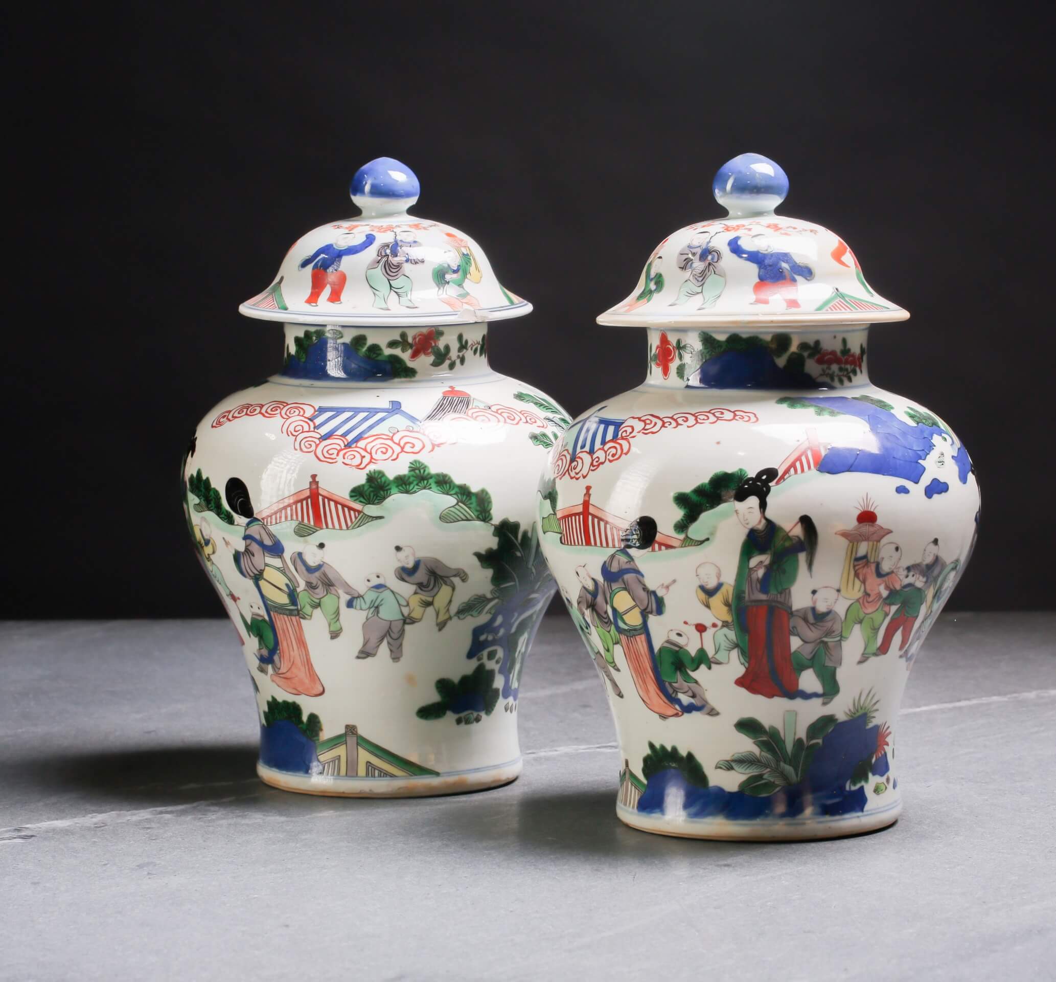 Pair of Chinese Wucai vases and covers